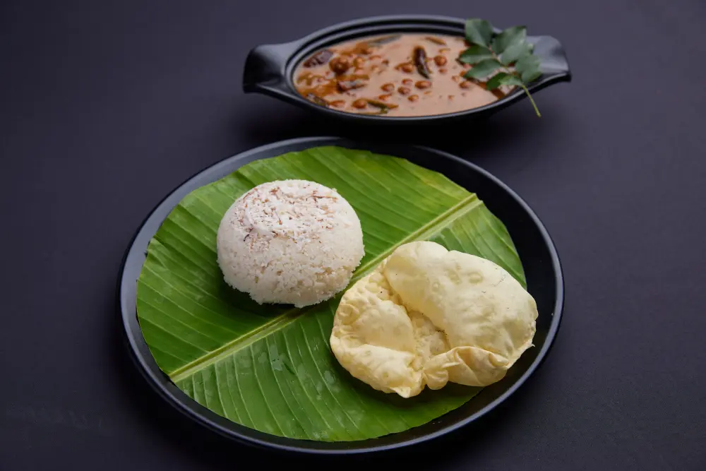 Traditional Kerala puttu served with kadala curry